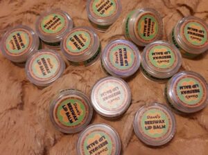 containers of beeswax lip balm