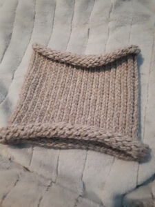 Loom knit cowl in beige, acrylic yarn