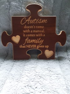 autism family puzzle shaped sign