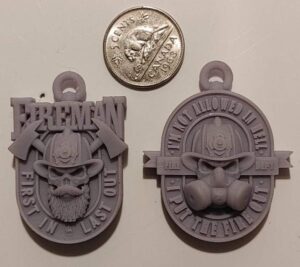 3D Printed Firefighter Pendants with coins to show size