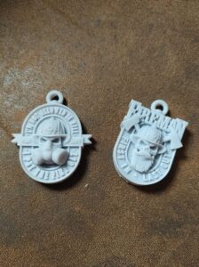 3D Printed Firefighter Pendants with primer
